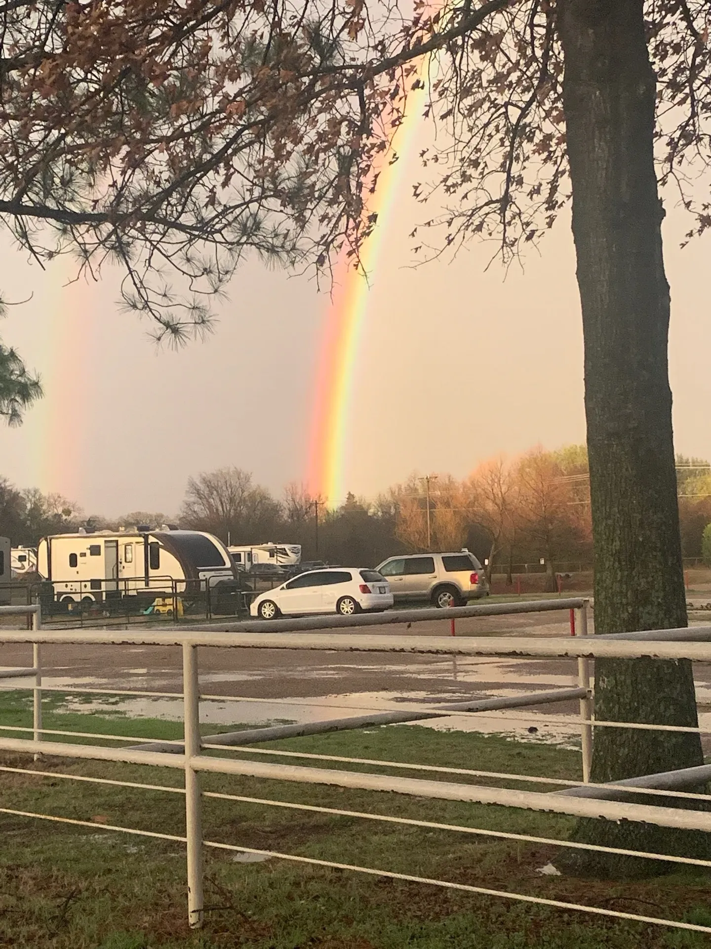 A double rainbow over the RV sites after a spring storm · Waggin' Tail Ranch RV Resort, Pilot Point, Texas