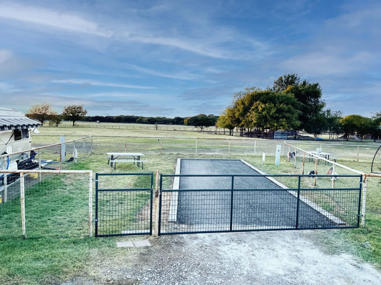 A private fenced yard with its own drive gate at an RV site at Waggin' Tail Ranch RV Resort